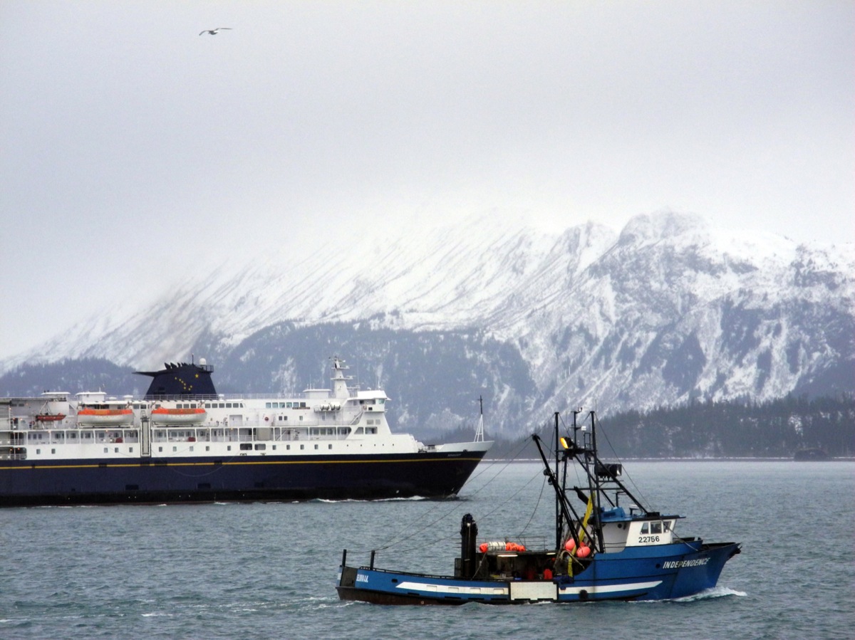 The F/V Independence passes the M/V Kennicott last month during the Industry Outlook Forum as the ships round Land's End Resort on the Homer Spit. According to state surveys, the number of visitors coming to Alaska by the Alaska Highway and state ferries has declined since a peak of 109,000 in 2004 to 69,000 last year.                           -Photo by Michael Armstrong, Homer News