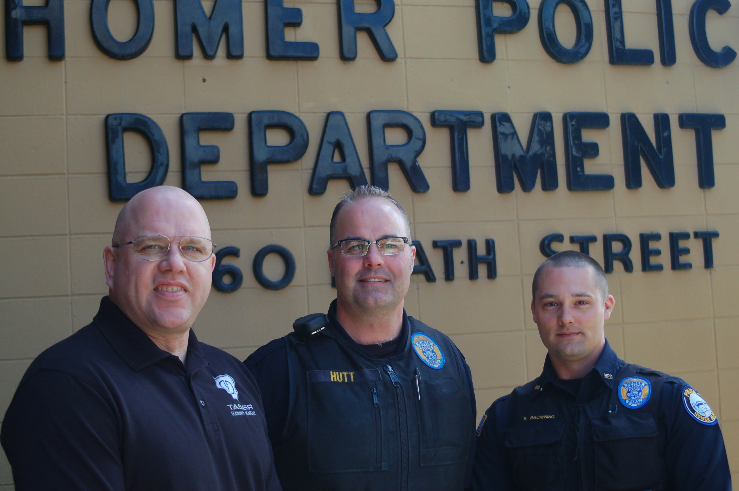 Lt. Randy Rosencrans, left, Lt. Will Hutt and Sgt. Ryan Browning pose in front of the Homer Police Station late last month. Rosencrans retired May 31 as the second-in-command of the police department, and Hutt was promoted from sergeant to lieutenant to take over. Browning was promoted from officer to sergeant to fill the vacancy created by Hutt’s promotion.