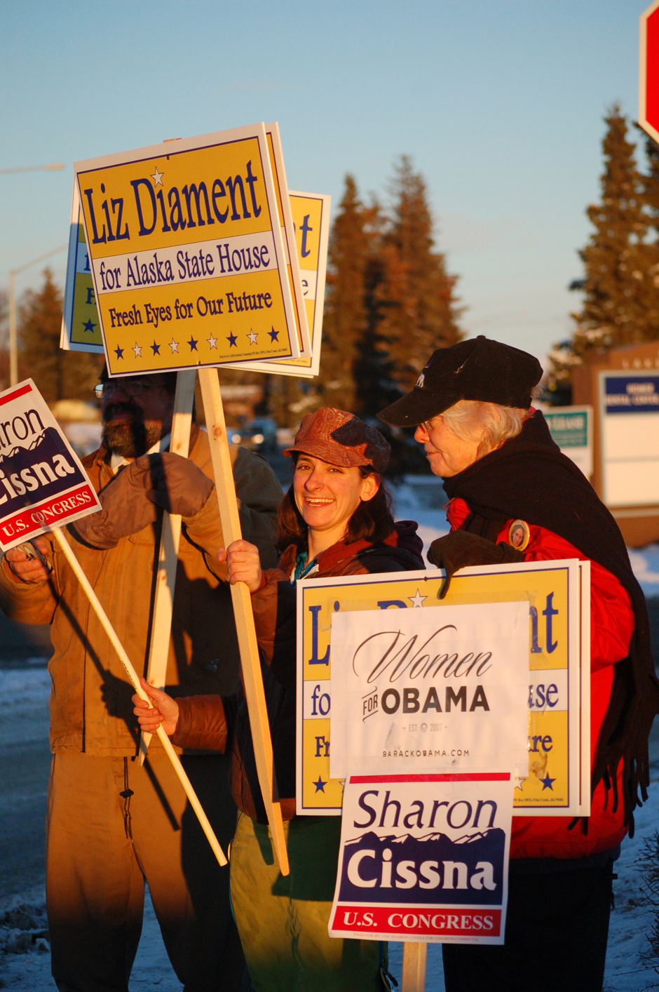 Kate Finn, right, and Gregg Browngoetz help Democratic Party candidate for House District Seat 30 Liz Diament campaign on Pioneer Avenue Tuesday afternoon. Diament and Finn also hold signs for Democratic Party candidate for U.S. House Sharon Cissna.-Photo by Michael Armstrong, Homer News