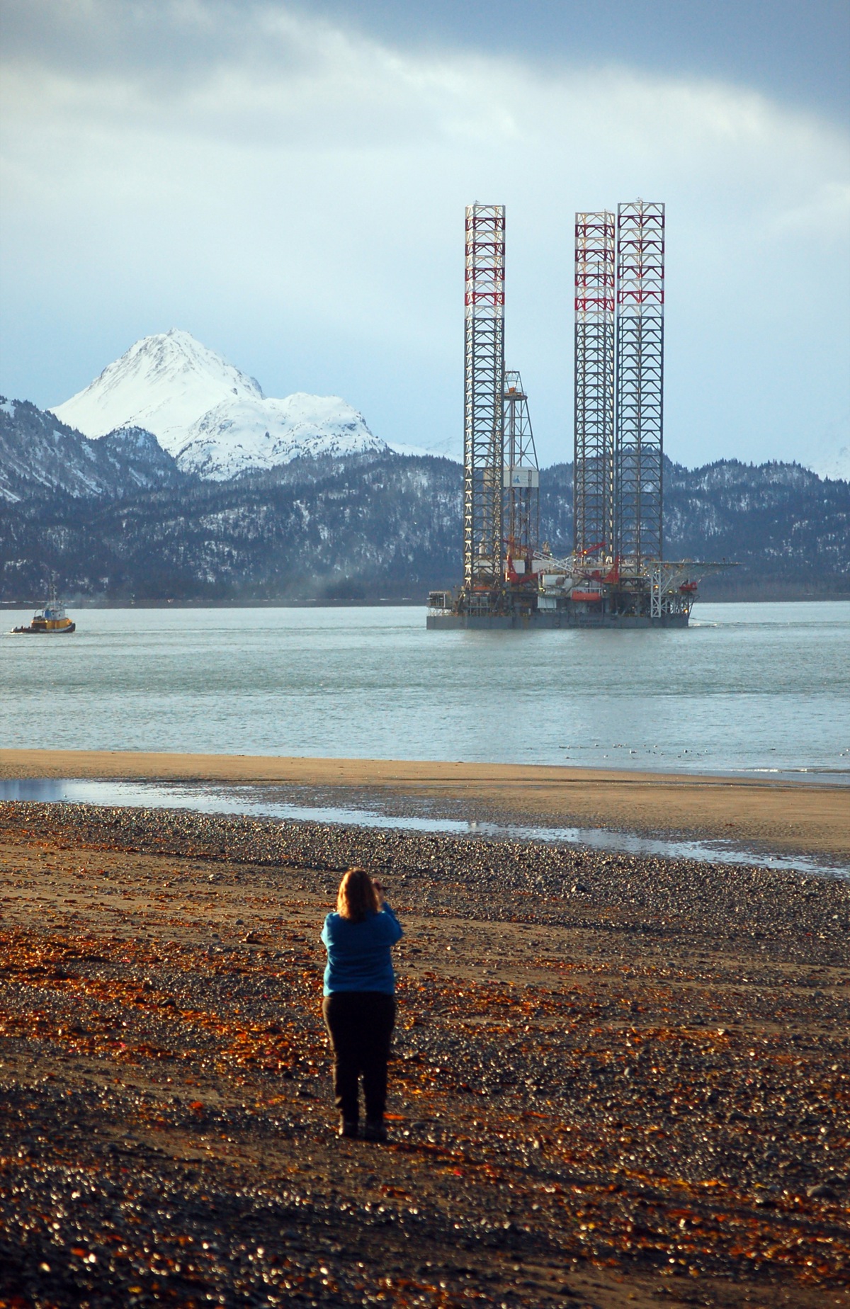 A woman takes a photo of the Endeavour-Spirit of Independence as it left Homer this morning about 8:30 -Photo by Michael Armstrong, Homer News