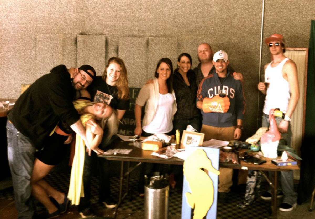 The Alibi team poses with its treasures at a previous scavenger hunt. From left to right are Mikes Bairamis, Kendall Winslow, Yarrow Jones, Kimber Leigh, Megan Palma, Jasen Cronk, Adam Season and Beau Grenwald.