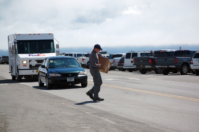 NOT GOOD: A man crosses the Spit Road outside the crosswalk.-Photo by Michael Armstrong, Homer News