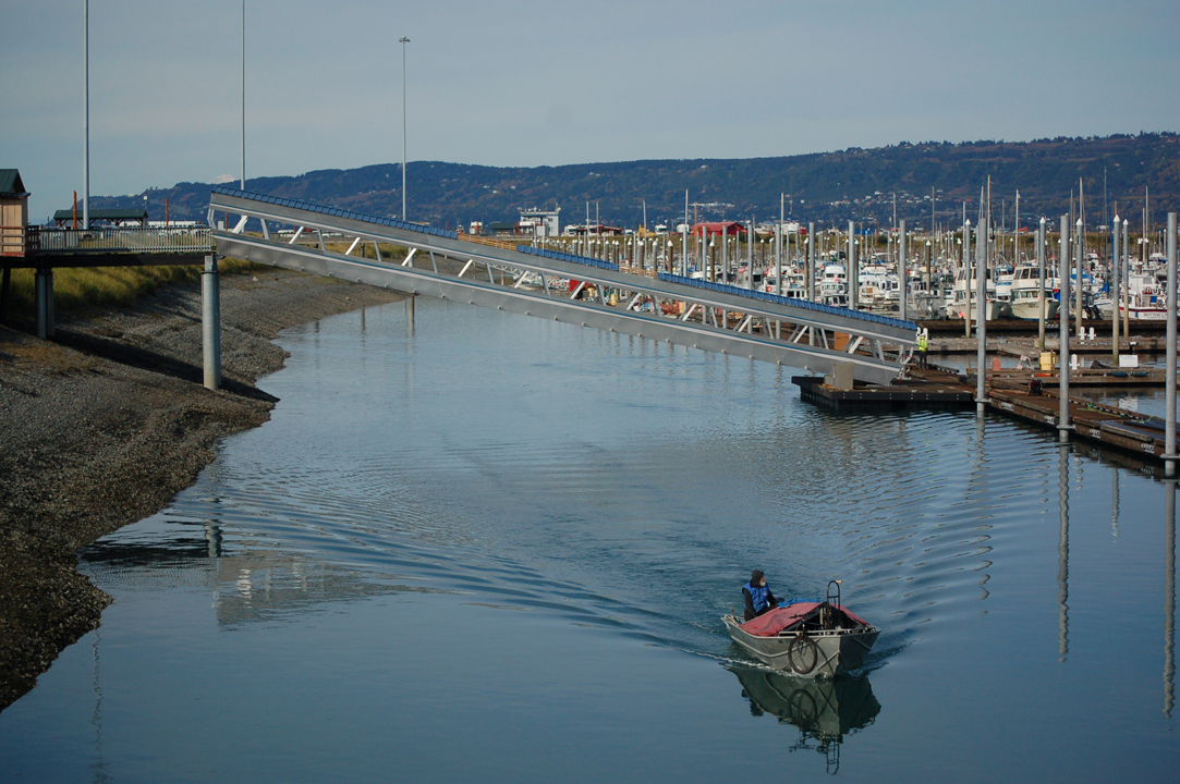 A boat passes under the new Ramp 3 at the Homer Harbor last Friday. -Photo by Michael Armstrong, Homer News