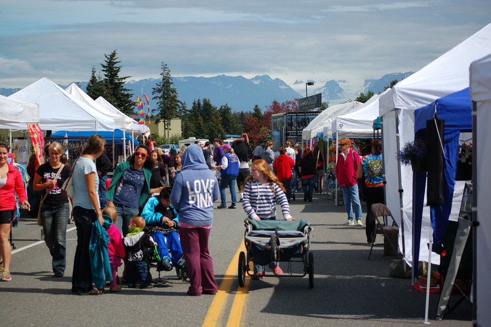 Visitors stroll down Hazel Avenue for the Homer Council on the Arts Street Faire.-Photo by Michael Armstrong, Homer News