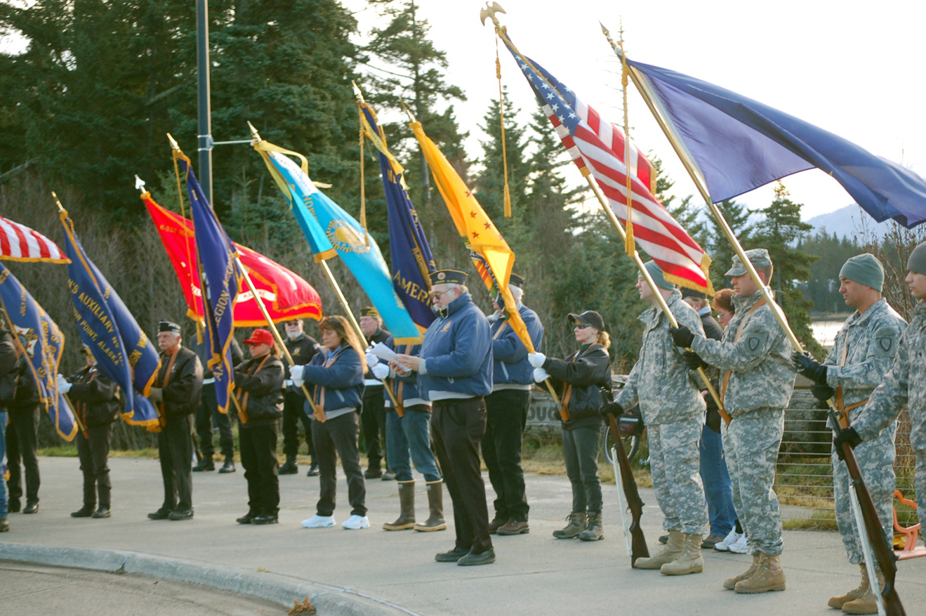 Craig Forrest, left, of the American Legion Post 16 delivers the Veterans Day address in ceremonies at the Veterans Memorial, Alaska Islands and Ocean Visitor Center.-Photo by Michael Armstrong, Homer News