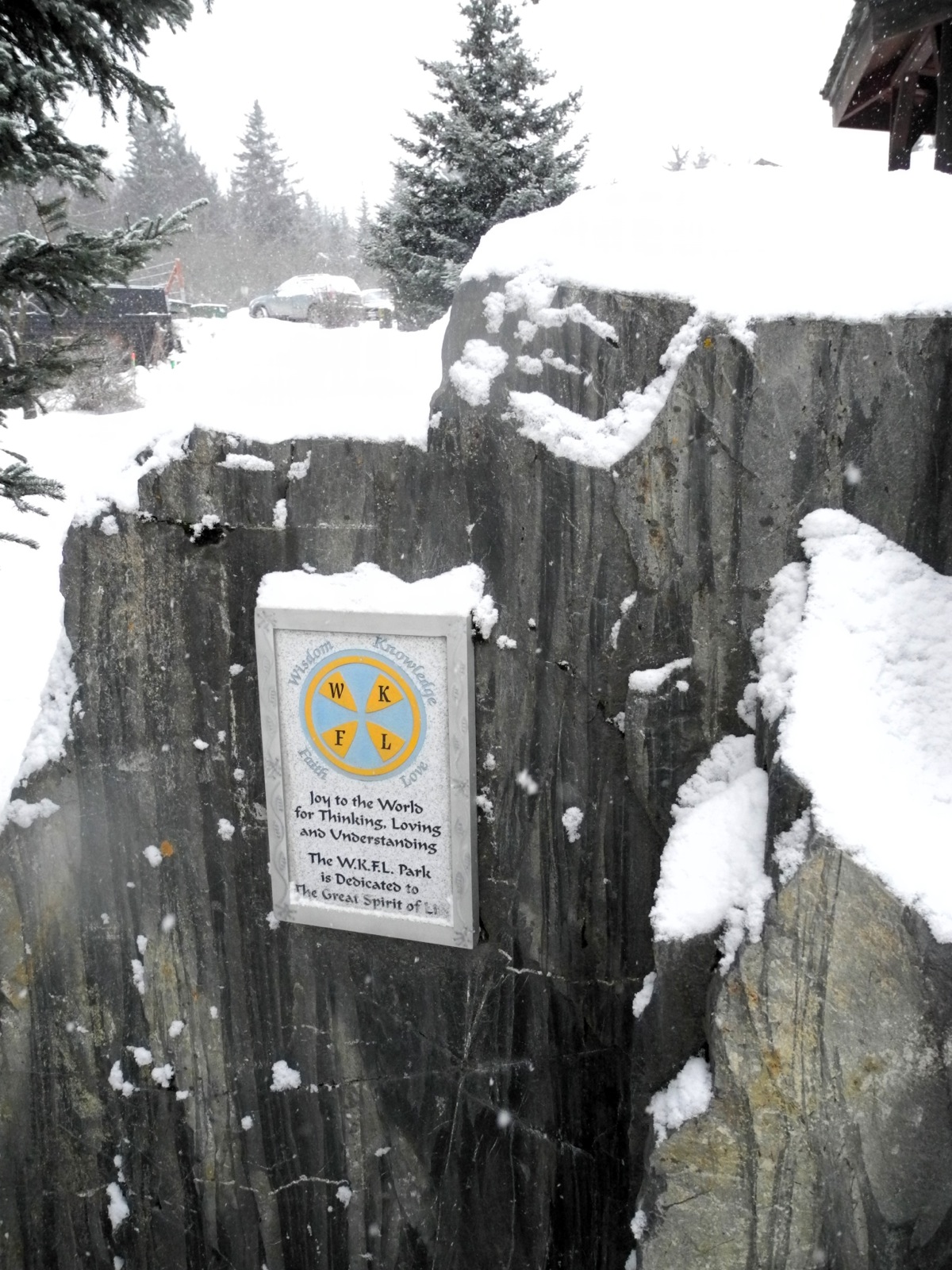 Fresh snow covers the rock at WKFL Park on Valentine's Day. John Nazarian proposed donating a bronze statue of Brother Asaiah Bates to go on this rock. A plaque on the rock explains the meaning of WKFL — "Wisdom, Knowledge, Faith and Love."-Photo by Michael Armstrong, Homer News