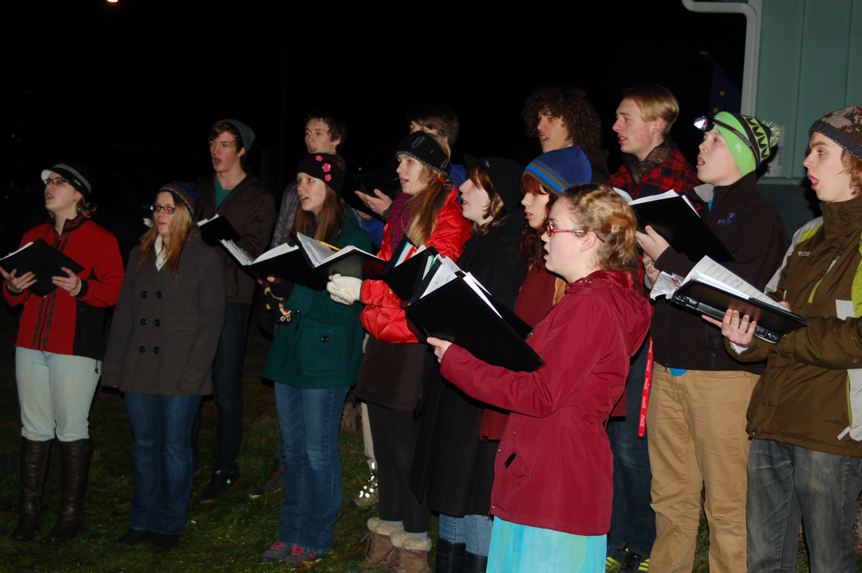 The Homer High School Swing Choir performs Dec. 5 during the third annual Christmas tree lighting at the Homer Chamber of Commerce and Visitor Center.-Photo by Michael Armstrong, Homer News