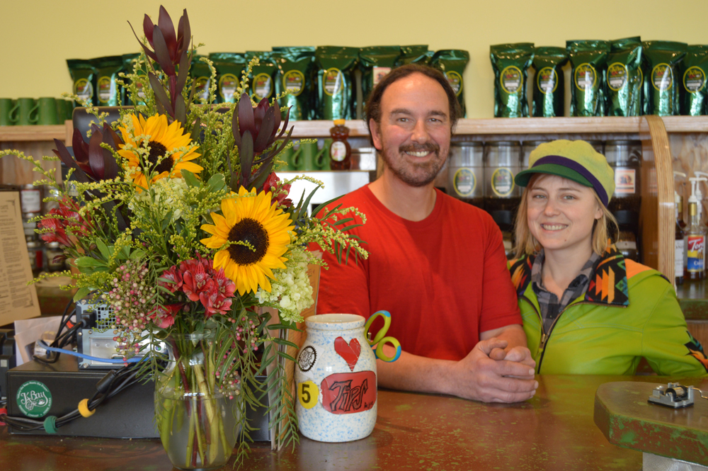 K-Bay Caffe owners Michael McGuire, left, and Caressa Starshine, right, pose for a photo behind the counter of the cafe’s new location at 378 E. Pioneer Avenue in the former Orca Plumbing building.-Annie Rosenthal
