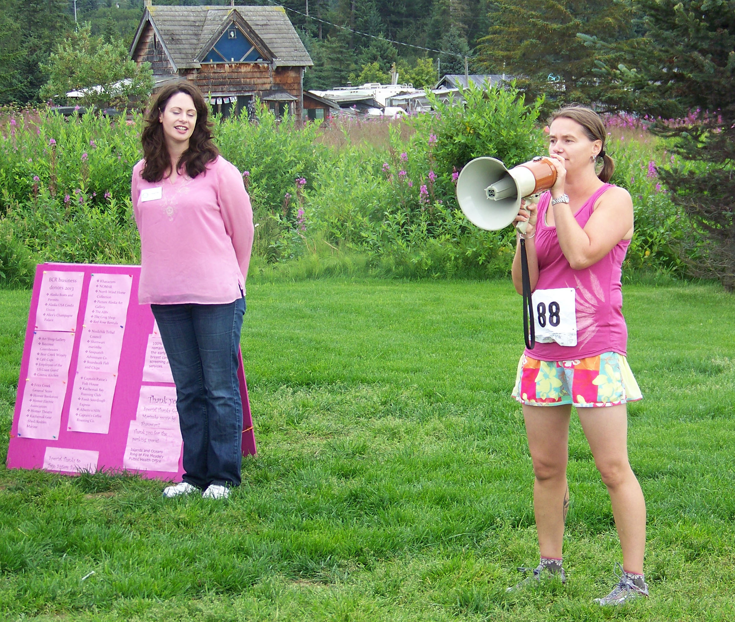 After Heather O'Conner, executive director of Kachemak Bay Family Planning Clinic, welcomed athletes to Sunday's Breast Cancer Run, KBFPC's Catriona Lowe gives runners and walkers last-minute instructions. -Photo by McKibben Jackinsky,  Homer News