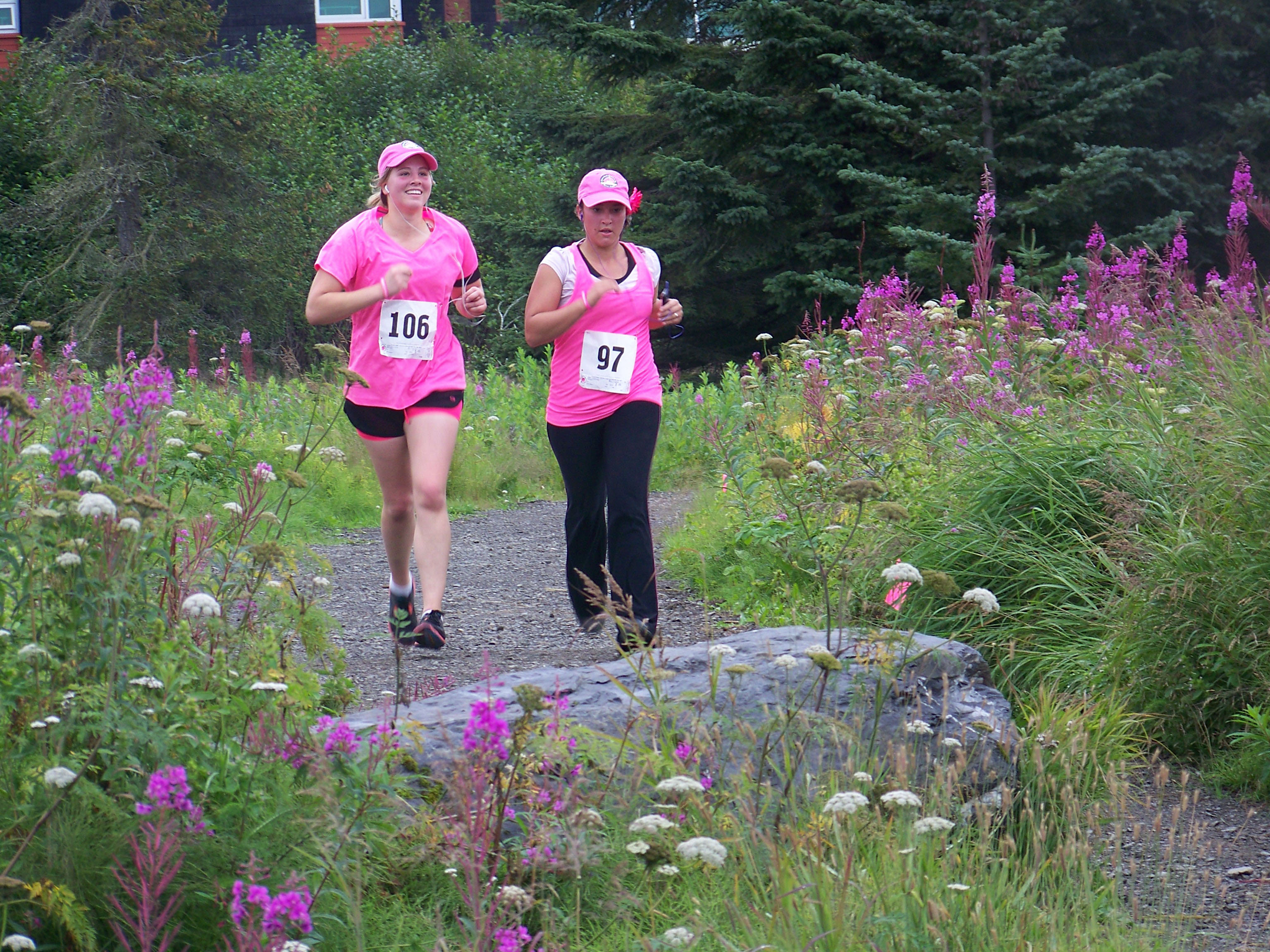 Runners Alivia Erickson, left, and Melinda Erickson head to the finish line of Sunday’s Breast Cancer Run. -Photo by McKibben Jackinsky,  Homer News