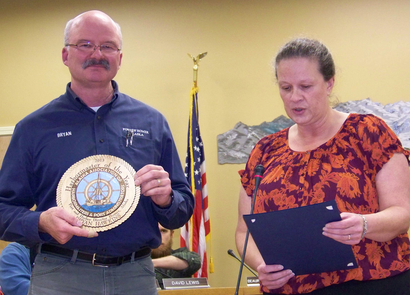 Homer Harbormaster Bryan Hawkins is recognized as the Alaska Association of Harbormasters and Port Administrators’ 2013 Harbormaster of the Year by Mayor Beth Wythe at Monday’s regular meeting of the Homer City Council.-Photo by McKibben Jackinsky, Homer News