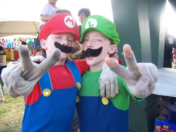 Ben “Mario” Rainwater and Judah “Luigi” Rainwater enjoy themselves at the community event.-Photo by McKibben Jackinsky, Homer News