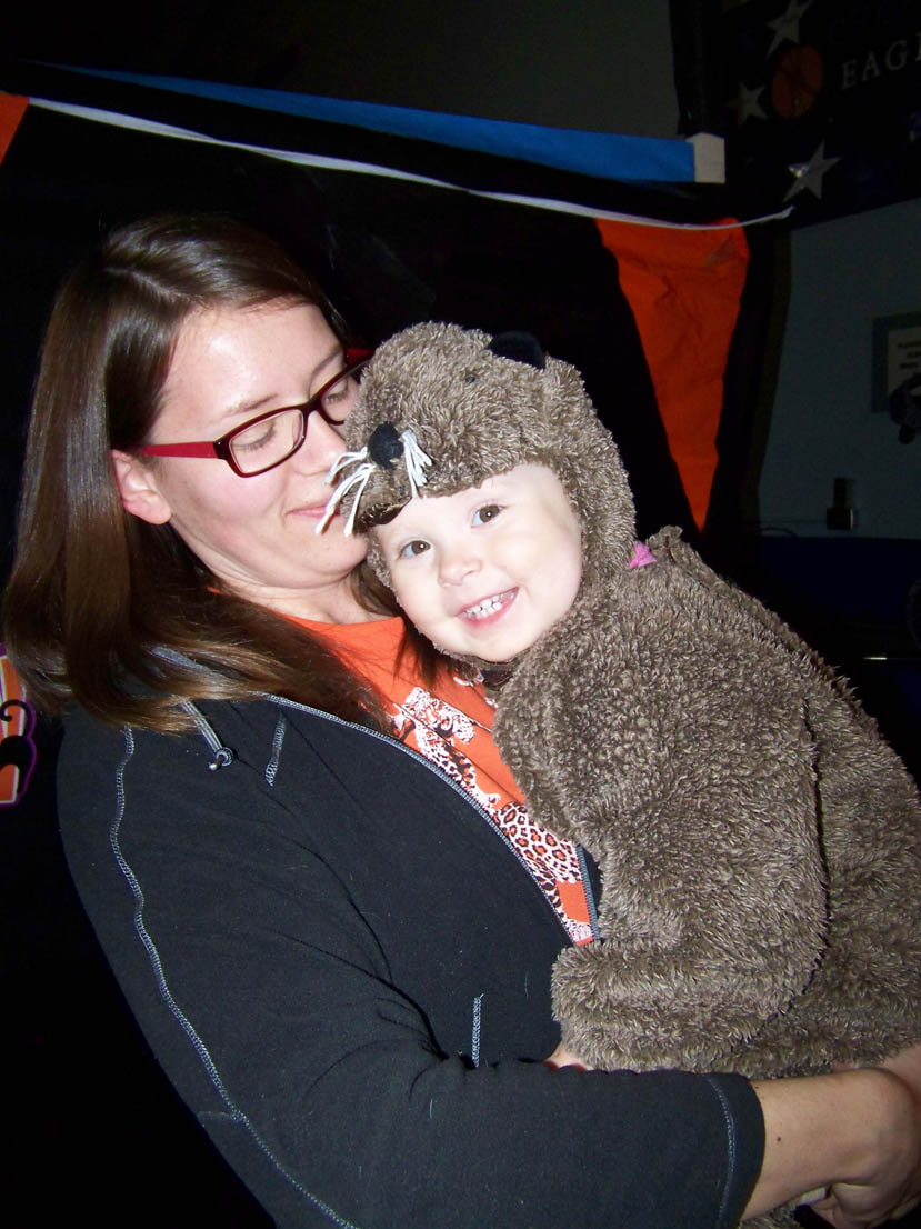 You "otter" be in pictures! Audrey Crocker, with her mom Meghan, shows off her otter costume worn at Chapman School's Halloween carnival last Friday.-Photo by McKibben Jackinsky, Homer News