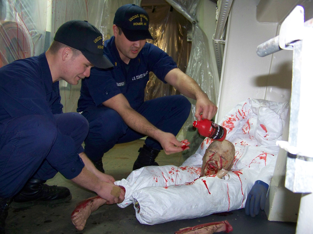 While Seaman Mike Ferraro, left, pieces together body parts, Ensign Brian Henderson tests fake blood in preparation for the Haunted Hickory’s 2010 scare-a-thon. The Haunted Hickory has become a Homer Halloween tradition.-Homer News file photo