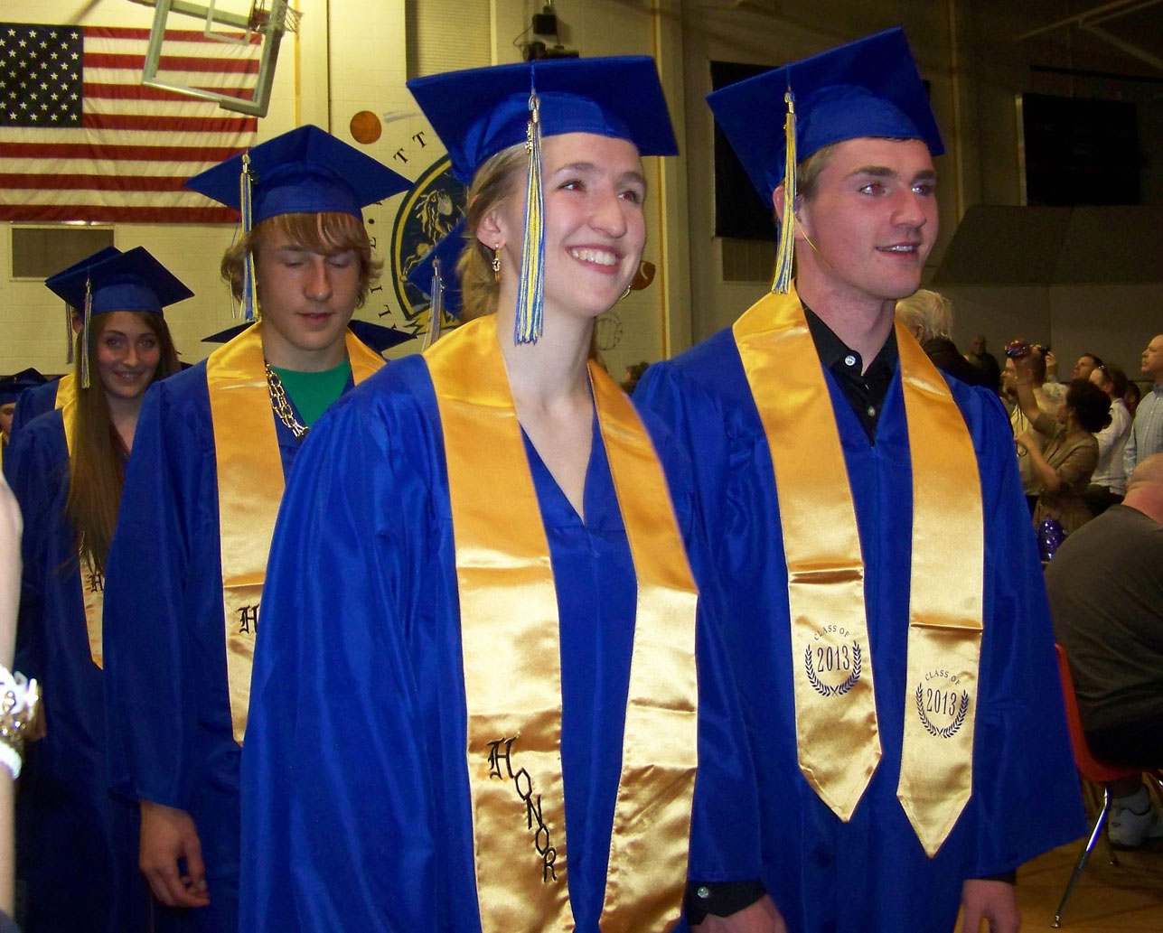 Homer High School graduates, from left, Katie Pitzman, Ethan Kizzia, Katie Kirsis and Grant Arseneau march into the gym at the school’s commencement ceremony Sunday evening.-Photo by McKIbben Jackinsky, Homer News