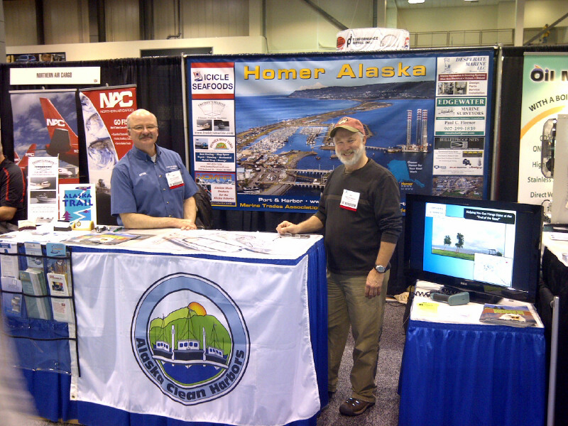 Homer Harbormaster Bryan Hawkins, left, and Mike Stockburger, owner of the Homer Boat Yard and a founding member of Homer Marine Trades Association, team up at the Pacific Marine Expo in Seattle last month.-Photo Provided