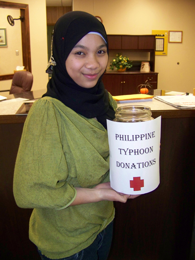 Homer High School exchange student Yusra Sahi of the Philippines is collecting donations to support Philippine Red Cross’s aid to victims of Typhoon Haiyan.  -Photo by McKibben Jackinsky, Homer News