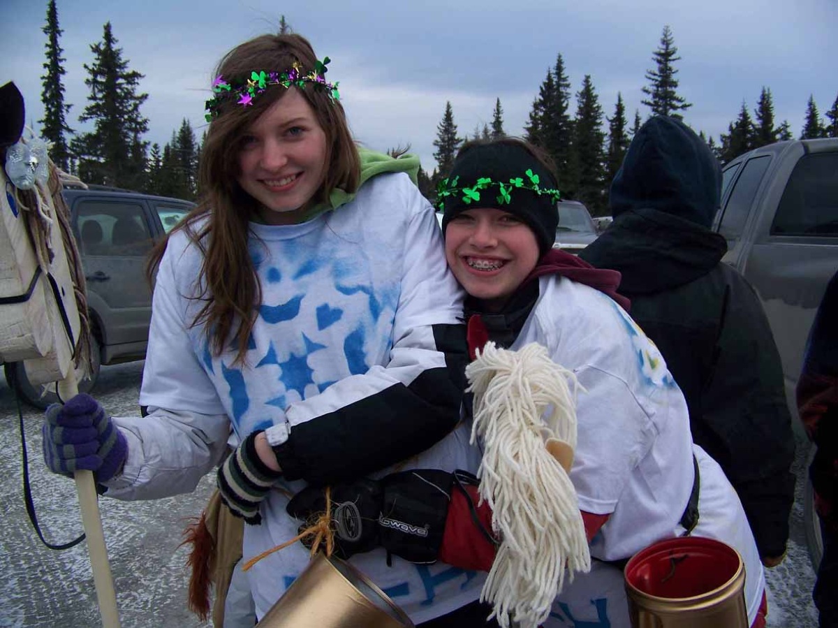 Melissa Clark and Melanie Mastolier represent the 4H Trailblazers Club in the 2012 Snow Rondi parade.-Photos by McKIbben Jackinsky, Homer News