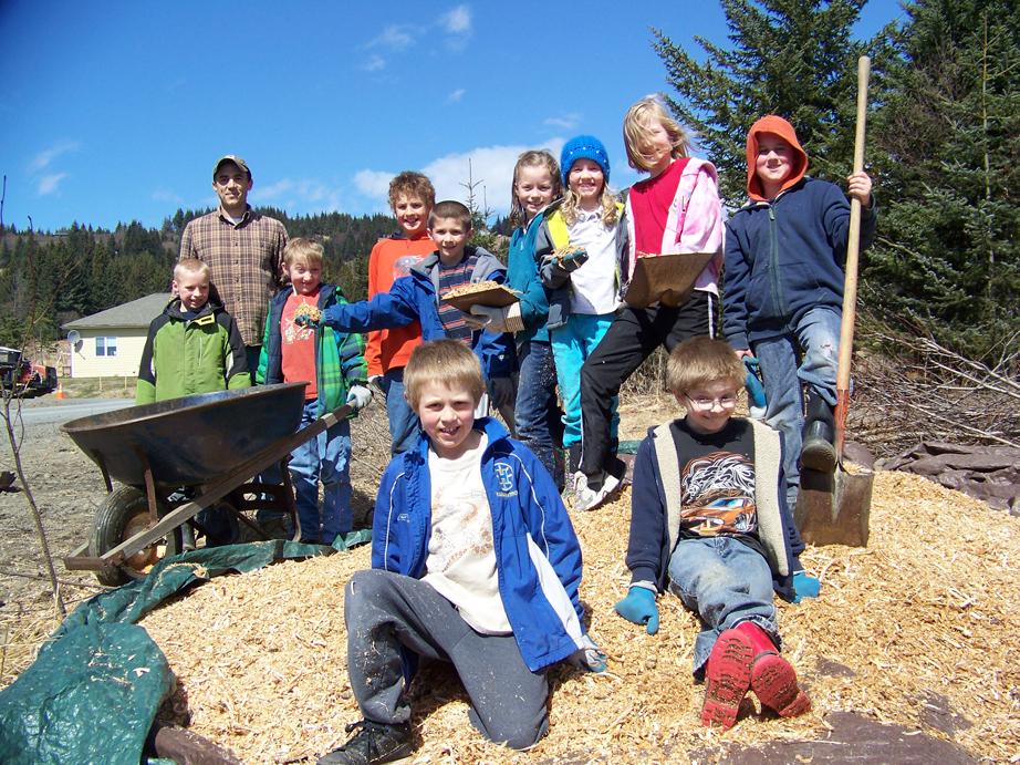 West Homer Elementary School trail crew working with Todd Schroeder of the Homer Soil and Water Conservation District, second from left, included third graders, back row, from left, Keith Roderick, Ridge Marion, Henry Lemieux, Ryan Carroll, Kaylin Anderson, Ava Halstead, Harper Miller, Robby Venendaal; front row from left, Keegan Strong and Taer Nelson.-Photos by McKibben Jackinsky, Homer News