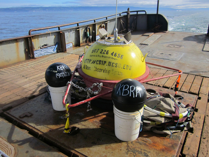 Two drifter buoys are next to a larger wave buoy deployed in another project.    -Photo provided