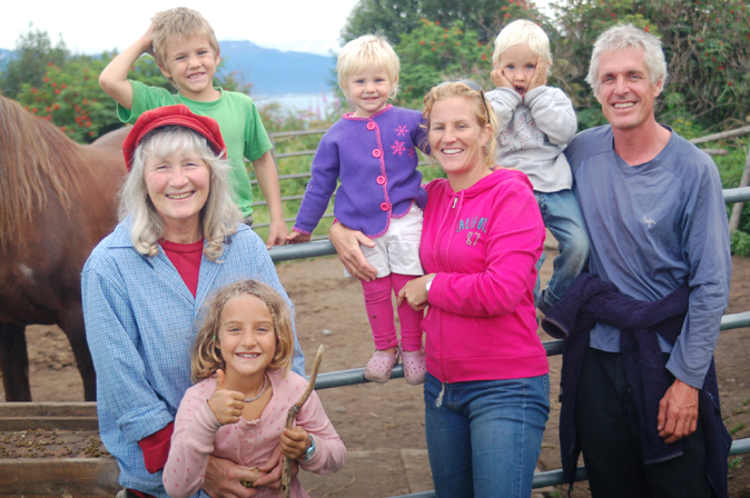 The Schwoerer family of the S/V Pachamama and the Top To Top Expedition pose with Mossy Kilcher at Seaside Farm. From left to right, front, are Kilcher and Salina; back, Andri, Alegra, Sabine, Noe and Dario Schwoerer.-Photo by Michael Armstorng, Homer News