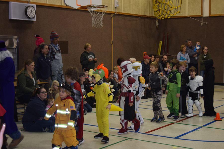 Paul Banks Elementary students parade around the school gym to show off their costumes to family members.-Photo by Wendy Todd