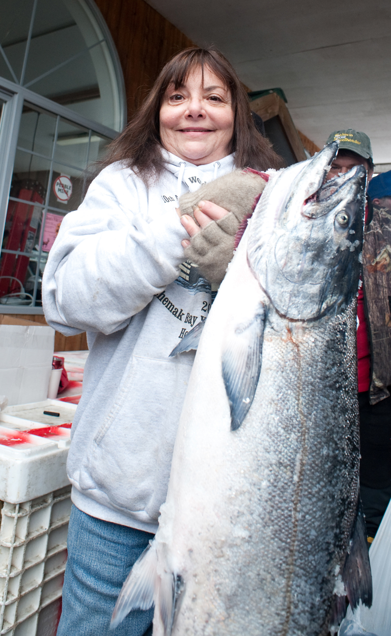 Brenda Hays holds a third-place winner in the 2010 Winter King Salmon Tournament.  Her fish tipped the scales at 29.4 pounds and was worth a total of $9,515. This year’s tournament runs 9 a.m.-4 p.m. Saturday.-Homer News file photo