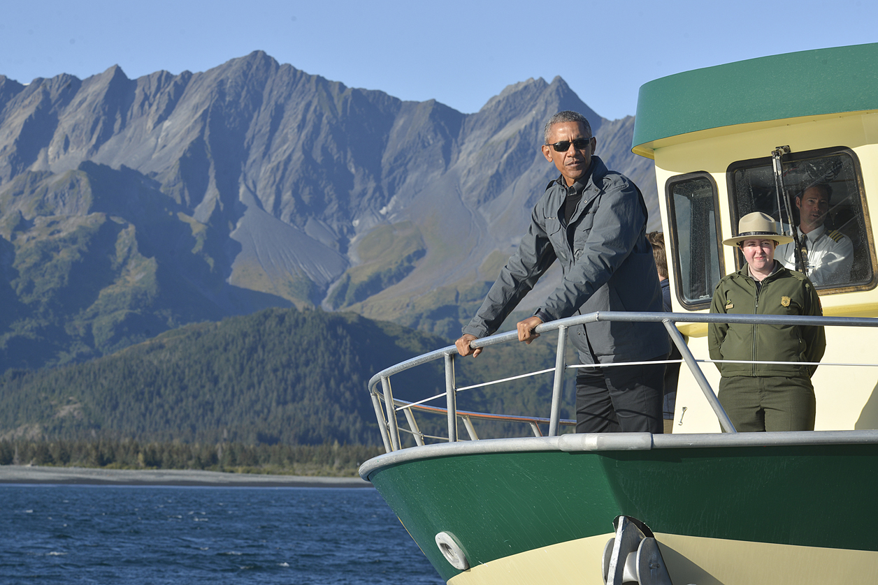 At Bear Glacier near Seward, President Barack Obama talks about the rapid retreat of the ice and the large pieces calving off of the main body of ice during a tour of Kenai Fjords National Park on Tuesday.-Morris News Service - Alaska