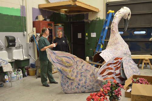 Steve Krause and Bobby Copeland-McKinney discuss repairs to the Nutcracker’s swan. Over 100 volunteers worked on the show. -Photo by Annie Rosenthal, Homer News