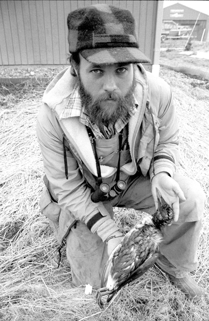 Willy Dunne holds an oiled murre found on Bishop’s Beach on April 17, 1989.-Photo by Hal Spence, Homer News