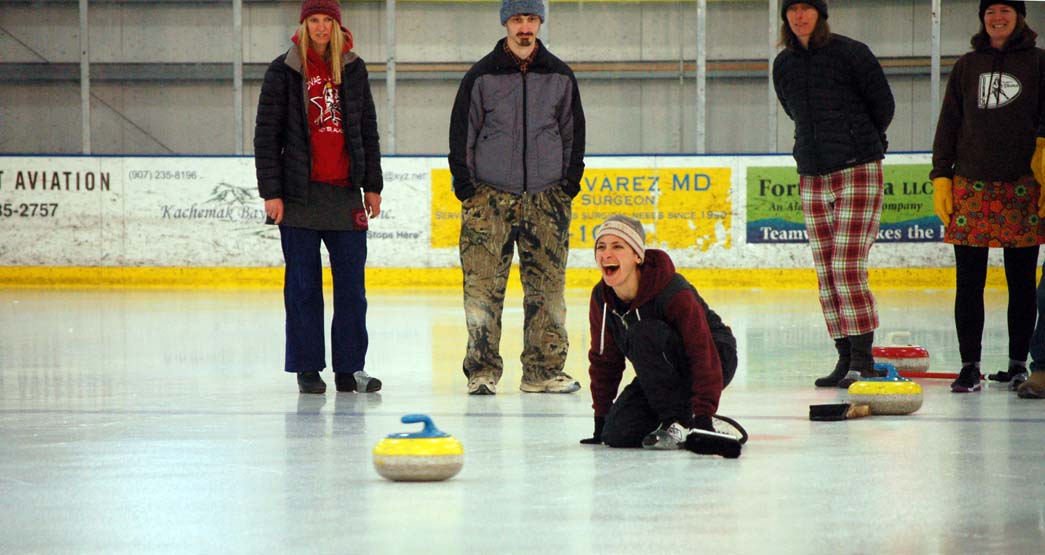 Liz Diament laughs as she throws a stone during a curling demonstration on Sunday. Diament slid the stone right on the center, or button, of the circular target. -Michael Armstrong-Homer News