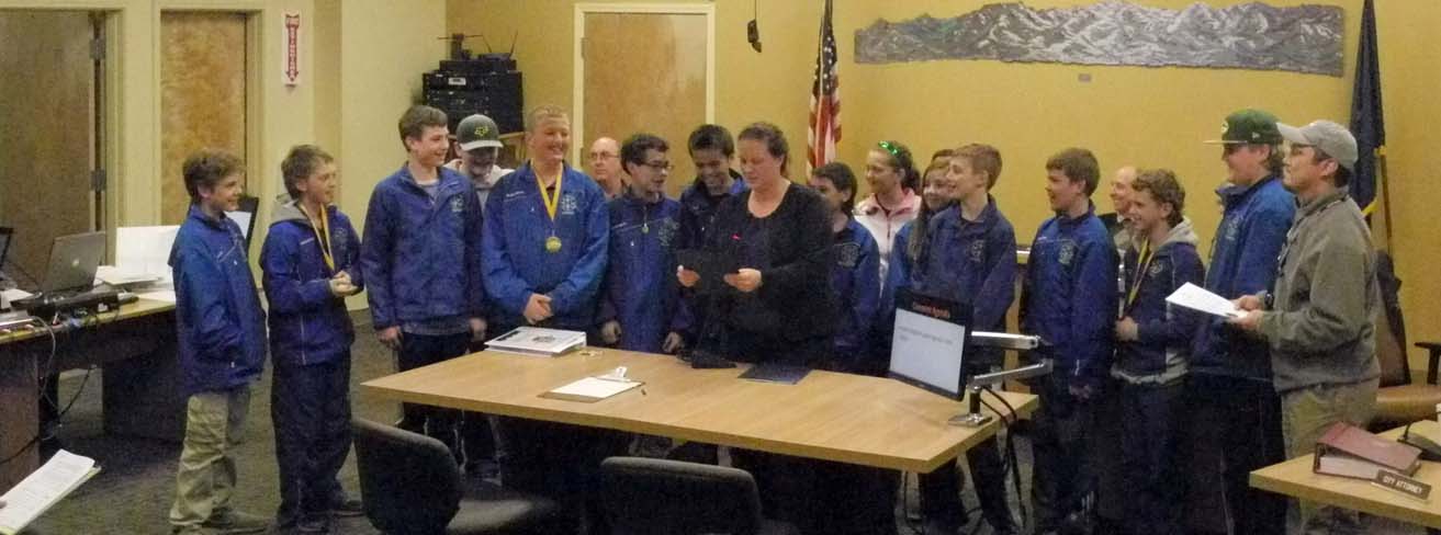 Homer Mayor Beth Wythe reads a proclamation honoring the Homer Glacier Kings Pee Wee hockey team state champions at the Homer City Council meeting on Monday. From left: Liam Coleman, Tyler Gilliland, Tucker Weston, Conner Roderick, Colby Marion, council member David Lewis, Hunter Warren, Isaiah Nevak, Mayor Beth Wythe, Karl Wickstrom, Kaitlyn Johnson, Claire Bryant, Ethan Pitzman, Phinny Weston, council member Bryan Zak, Lee Lowe, Finn Heimbold and Coach Steve Nevak.                             -Michael Armstrong-Homer News