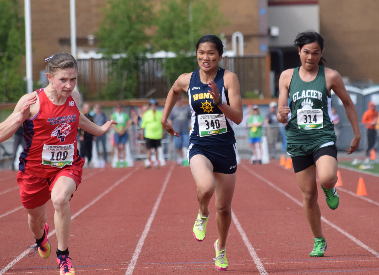 Homer freshman Kaylee Veldstra (340) races her way to a runner-up finish in the 1-2-3A girls 100-meter sprint at the state track and field championships Saturday at Dimond Alumni Field in Anchorage.-Photo by Joey Klecka, Peninsula Clarion