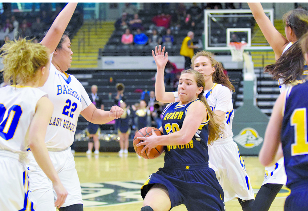 Homer senior guard Aurora Waclawski drives to the rim amid a sea of Barrow defenders in Saturday’s Class 3A girls state championship game at the Alaska Airlines Center.-Photo by Joey Klecka, Morris News Service - Alaska