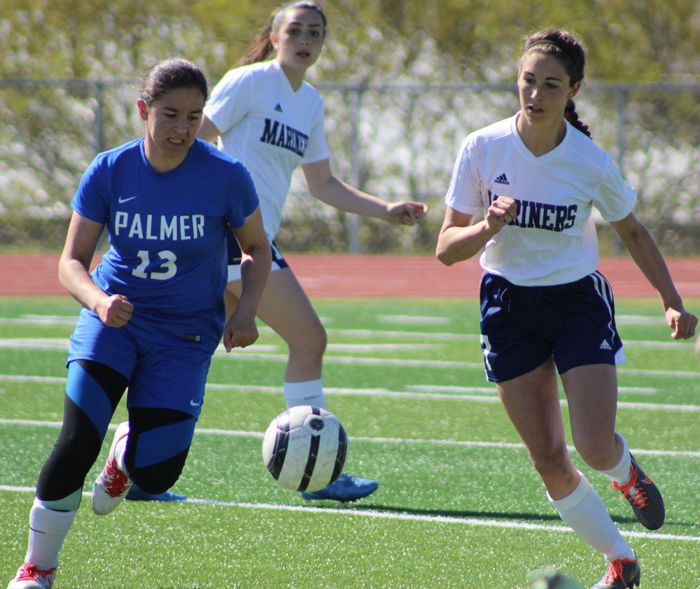 Mariah Vantrease rushes to take the ball away from a Palmer player during the girls varsity game at Homer High on Saturday, May 7.-Photo by Anna Frost; Homer News