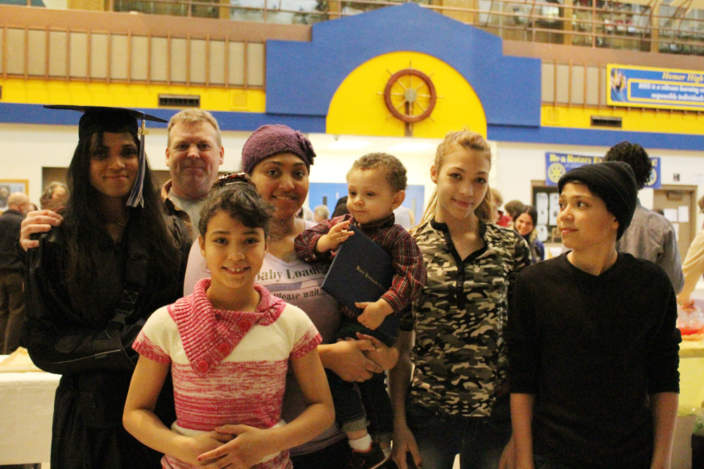 Tanise Latham is surrounded by her family at KBC’s graduation reception May 4. With her are her husband Chief Warrant Officer on the USCGC Hickory William Latham, Faith Latham,  Tay’Lia McMahon with her son Bentley Ryan McMahon, holding his grandmother’s degree, Heather Latham and Josh Latham.-Photo by Anna Frost, Homer News