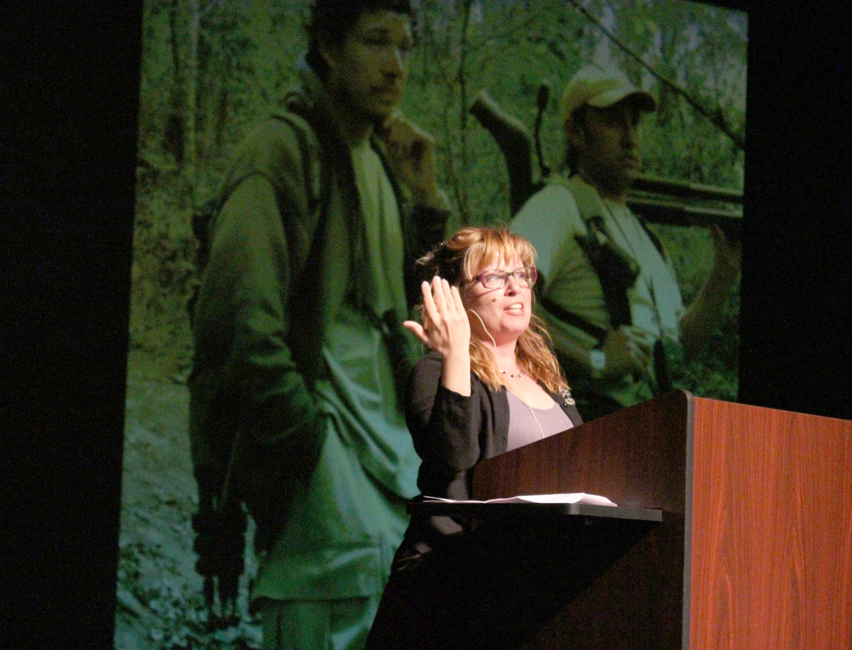 Sharon Stiteler talks about a birding trip where she climbed the side of a volcano to photograph a bird in Guatemala during her keynote speech, “1001 Secrets Every Birder Should Know.” -Photo by Anna Frost, Homer News