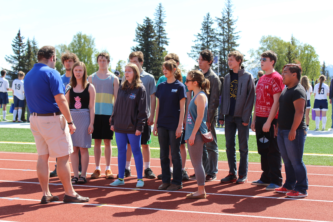The Homer High School swing choir performed the national anthem during Senior Day between the girls and boys varsity soccer teams' games. The Mariners played home games against Seward on Saturday, May 14.-Photo by Anna Frost; Homer News