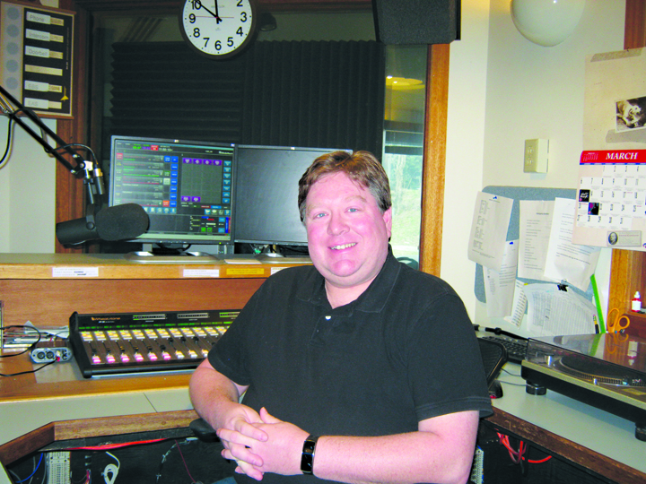 New KBBI 890 AM Public Radio General Manager Terry Rensel poses for a photo in the station studio. Rensel worked as the former program director since 2007 and had previously worked in public radio in Louisville, Ky., and Orlando, Fla.-Photo provided