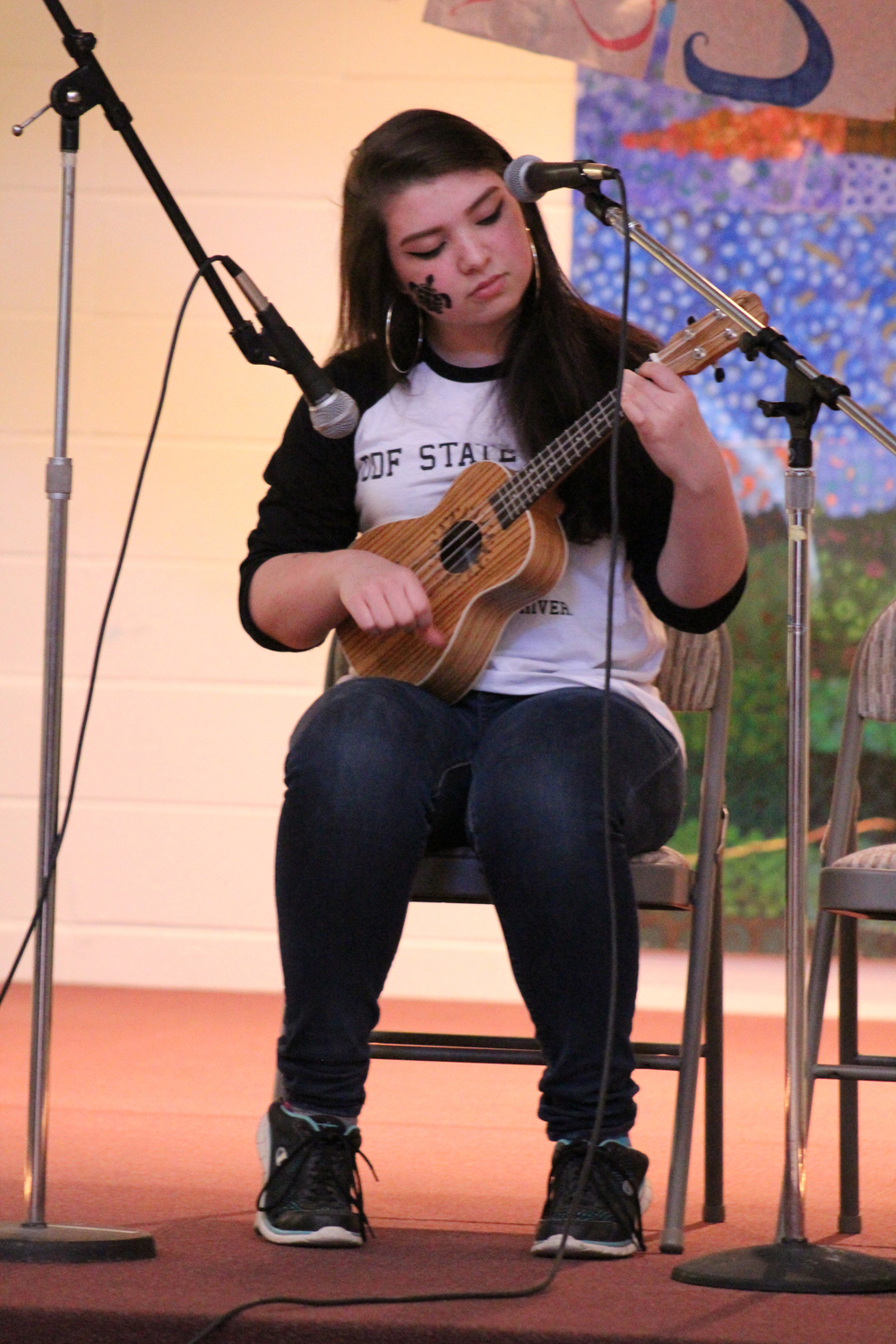 Ciara Jones plays the ukulele and sings Broadripple is Burning, a song by Margot and the Nuclear So and So's, at the Colors of Homer show on Saturday, April 16.-Photo by Anna Frost; Homer News