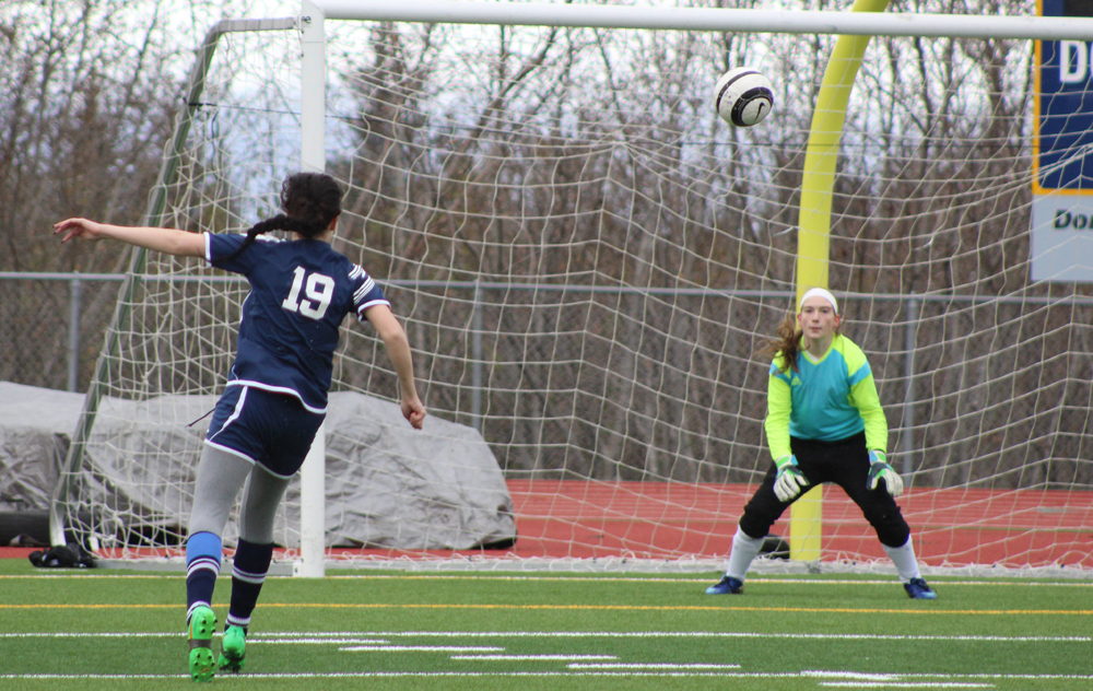 Sam Draves crouches slightly in preparation to catch a ball kicked toward the Homer goal by a Soldotna player. Homer girls played Soldotna on Tuesday, April 19 at Homer High, losing 3-0.-Photo by Anna Frost; Homer News