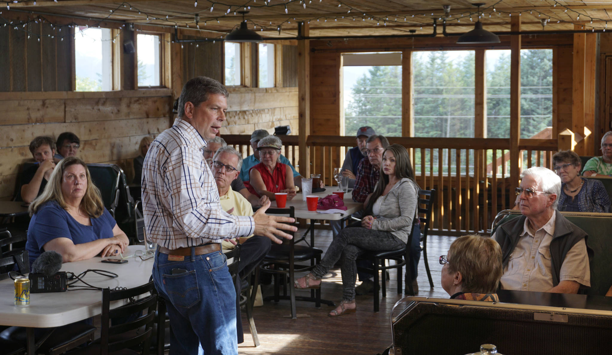 Mark Begich speaks to about 30 people last Thursday, July 26, 2018, at Alice’s Champagne Palace, Homer, Alaska. Begich, a former Anchorage mayor and U.S. Senator, is running for the Democratic Party nomination for governor. (Photo by Michael Armstrong/Homer News)