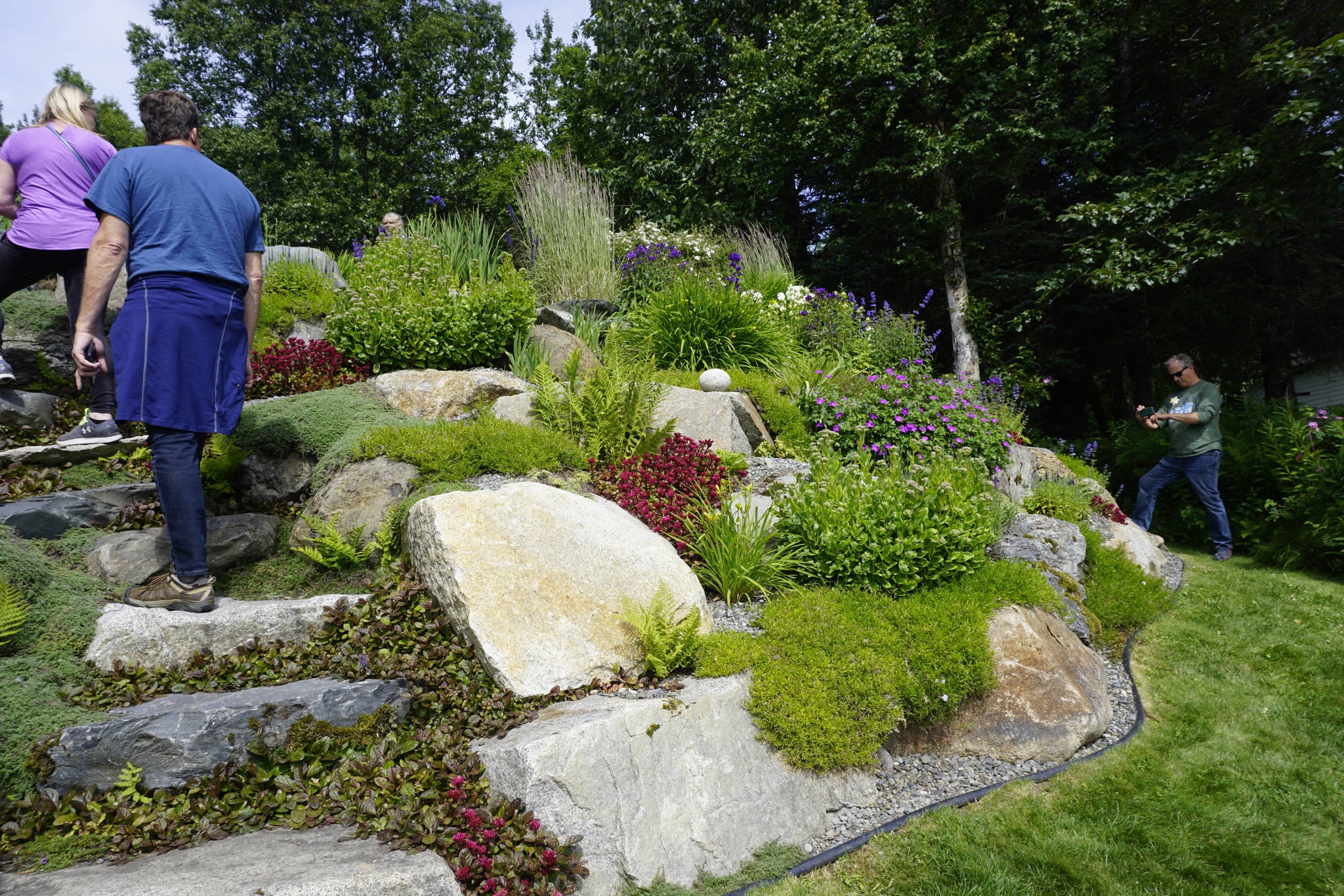 Steps are incorporated into the rock garden at the Flip and Marguerite Felton home off East Hill Road in Homer, Alaska. It was one of five gardens featured in the July 29, 2018 Homer Garden Tour. (Photo by Michael Armstrong/Homer News)