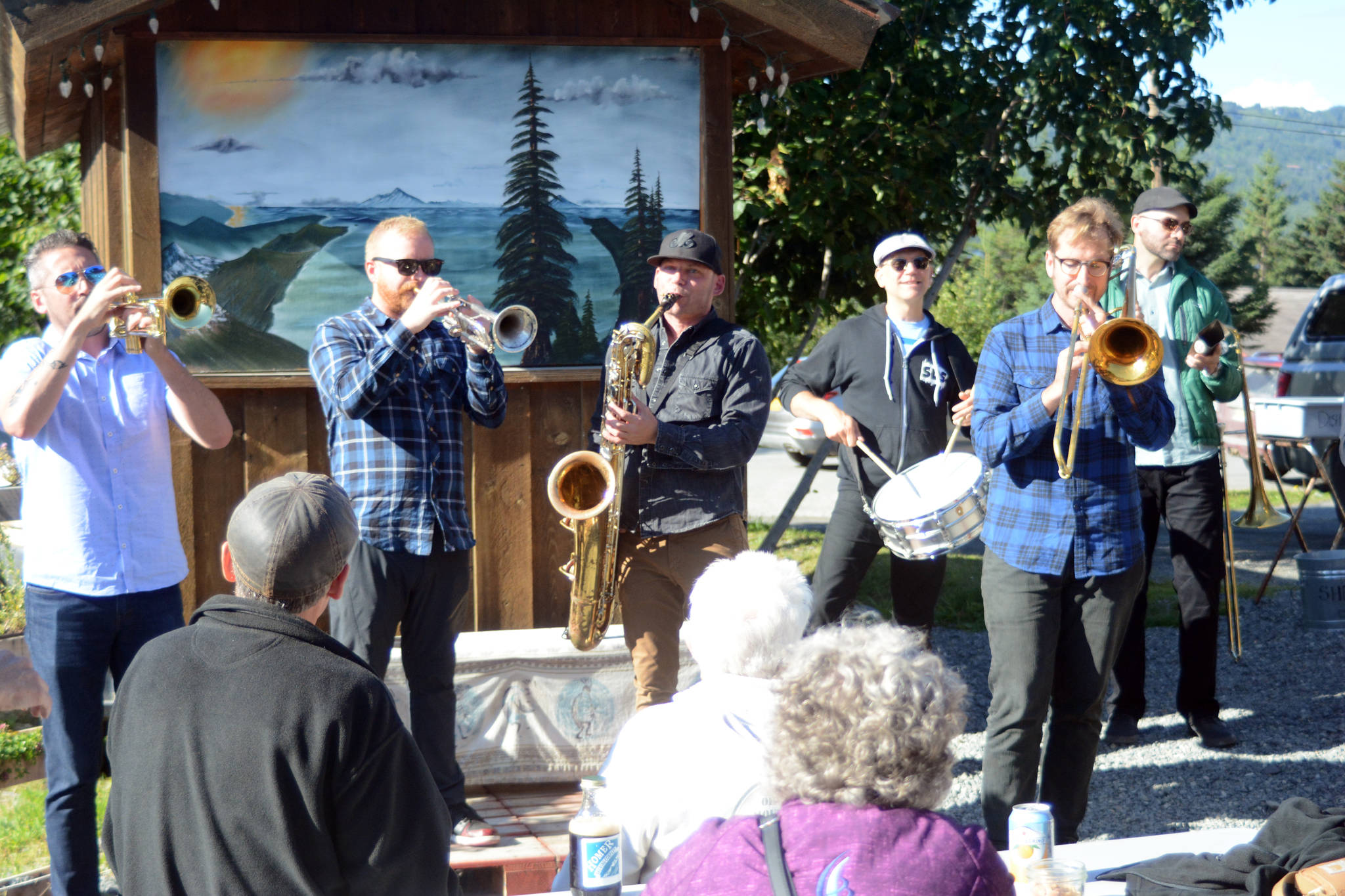 Members of the LowDown Brass Band perform an impromptu session Tuesday Aug. 7, 2018 at the Homer Brewery in Homer, Alaska. The band played at Salmonfest on Saturday, at Alice’s Champagne Palace on Tuesday at Soldotna Creek Park on Wednesday. (Photo by Michael Armstrong/Homer News)