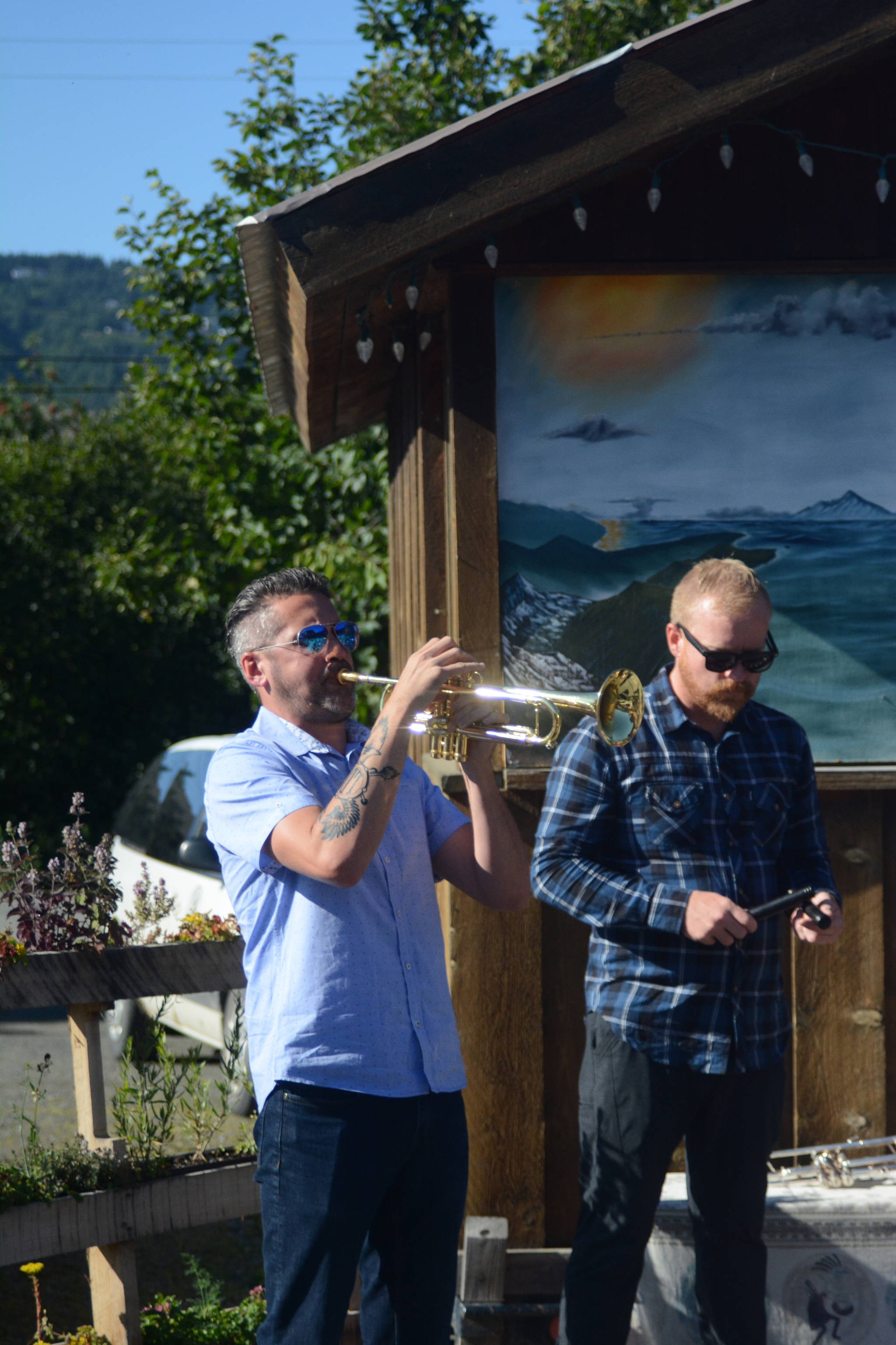 Shane Jonas, left, and Sam Johnson, right, of the LowDown Brass Band perform an impromptu session Tuesday Aug. 7, 2018 at the Homer Brewery in Homer, Alaska. The band played at Salmonfest on Saturday, at Alice’s Champagne Palace on Tuesday and at Soldotna Creek Park on Wednesday. (Photo by Michael Armstrong/Homer News)