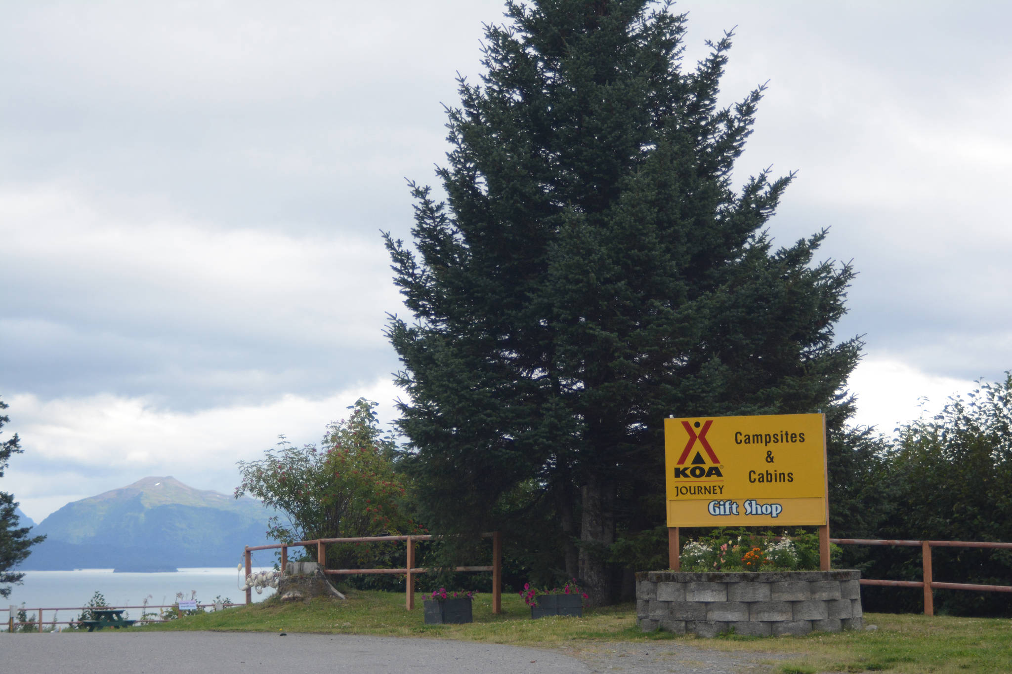A sign at the Homer/Baycrest KOA Holiday office on Aug, 18, 2018, announces that the park looking out over Kachemak Bay near Baycrest Hill in Homer, Alaska is now a Kampgrounds of America facility. KOA added the business to its network this summer, KOA announced this month in a press release. (Photo by Michael Armstrong/Homer News)