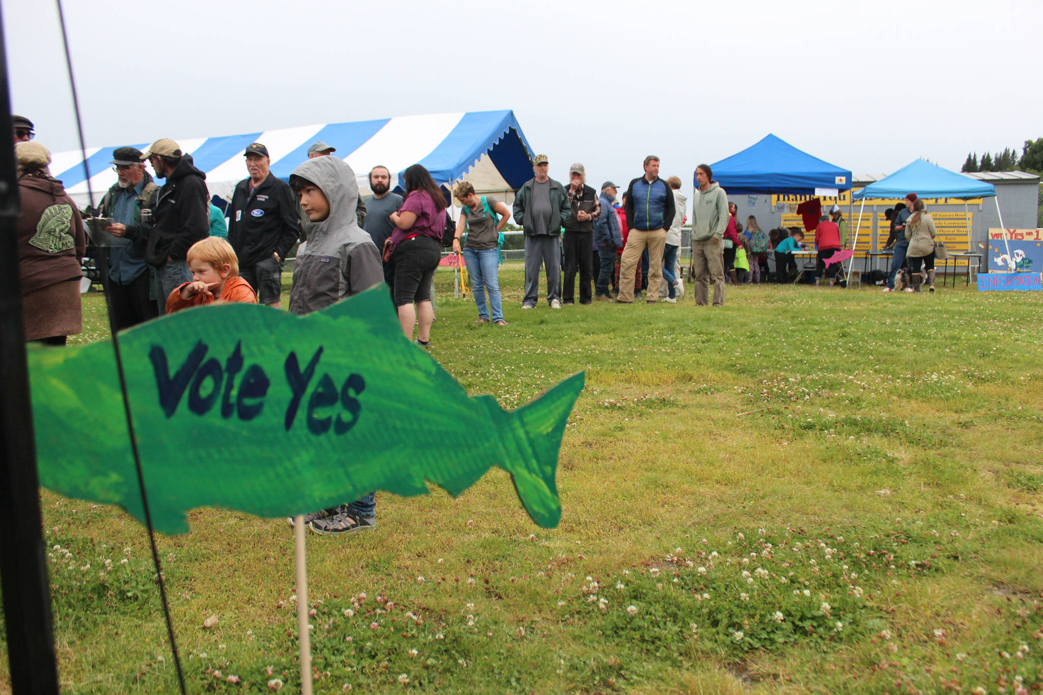 Area residents wait in line for some salmon at a barbecue held Friday, Aug. 10, 2018 for Alaska Wild Salmon Day in Karen Hornaday Park in Homer, Alaska. (Photo by Megan Pacer/Homer News)