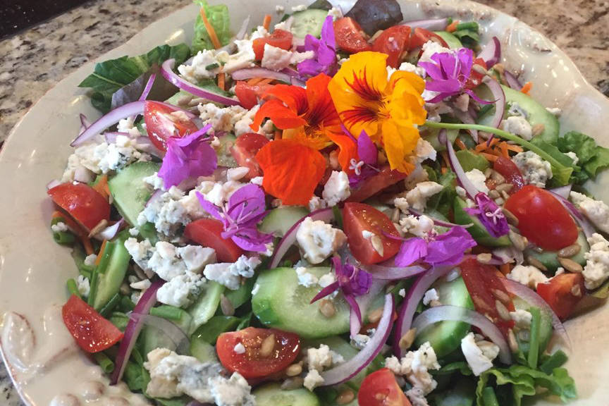 Big, colorful salads made with fresh ingredients from the garden are a summer staple. (Photo by Teri Robl)