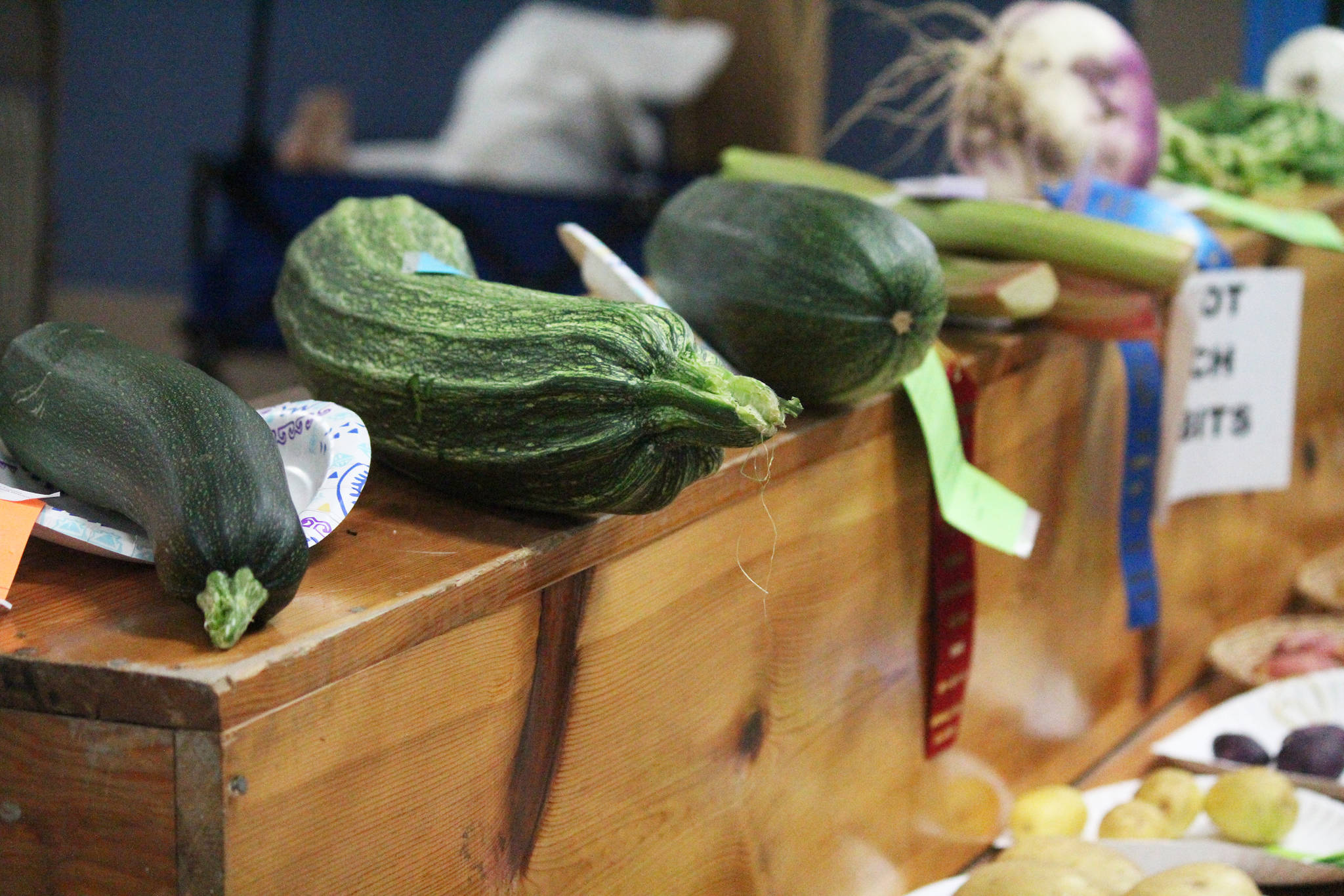 Prize-winning vegetables sit on display in one of the buildings on the Kenai Peninsula Fairgrounds on Saturday, Aug, 18, 2018 at the annual fair in Ninilchik, Alaska. (Photo by Megan Pacer/Homer News)