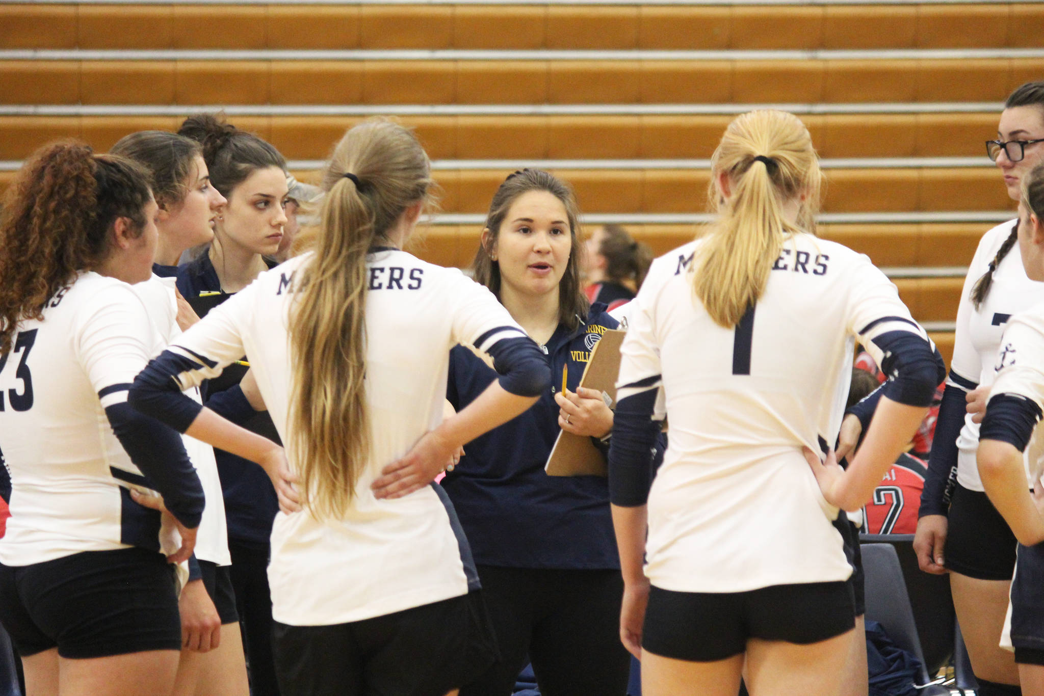 Sara Pennington, the new Homer head volleyball coach, talks to her players during a timeout in one of their games against Kenai Central High School in the Homer Jamboree, held Saturday, Aug. 18, 2018 at the high school in Homer, Alaska. Homer took third in the Jamboree. (Photo by Megan Pacer/Homer News)